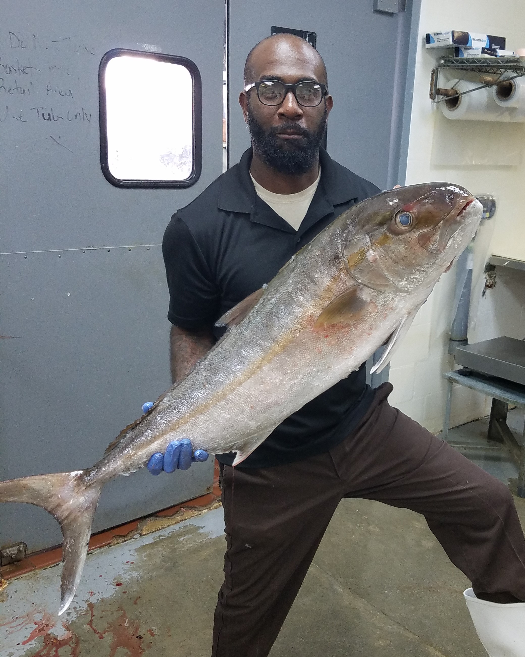 Man holding a large fish.